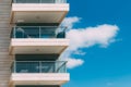 Balconies and blue sky with clouds. Part of a residential building in Israel. Royalty Free Stock Photo