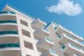Balconies and blue sky with clouds. Part of a residential building in Turkey. Modern apartment buildings on a sunny day Royalty Free Stock Photo