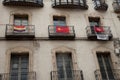 Balconies with flags in the city of Huesca.