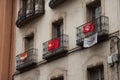 Balconies with flags in the city of Huesca.