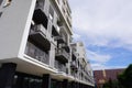 Balconies with iron fencing in a modern house, an unusual design in a new residential apartment building. recreation in urban