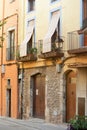 Balconies on an old stone building in Spain, on the second floor. Royalty Free Stock Photo