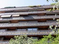 Balconies in a row on the facade of the urban historic building with ceramic ornament, Madrid, Spain