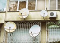 Balconies with satellite dishes and air conditioning Royalty Free Stock Photo