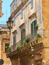 Balcony of a baroque palace in Lecce, Puglia.