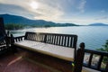 Balcony with bench near the sea on sunset