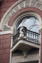 Balcony of the building is in classical style with decoration in the form of fish. Kiev