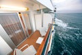 Balcony with chairs table lamp on ship