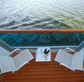 Balcony with chairs table on ship