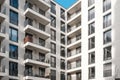 Balcony facade on corner of modern apartment building complex Royalty Free Stock Photo