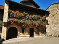 Balcony with flowers in an ancient house of the municipality of Lierganes, Cantabria, Spain