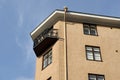 Balcony with a forged grille and downspout