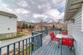 Balcony of home with glorious views of snowy mountain peaks and overcast sky