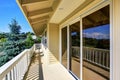 Balcony house exterior with wooden railings and perfect view.