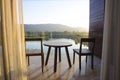 Balcony of house lake view with wooden table and chair Royalty Free Stock Photo