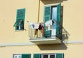 Terrace is used to hang clothes in a normal family home.