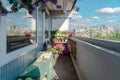 Balcony plants, beautiful different colored flowers, blu sky