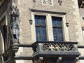 Balcony with on a side a medieval statue of a gothic building of Prague in Czech Republic.