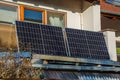 Balcony solar power plant. Solar battery on balcony wall. Mini PV plants generate your own electricity plug play