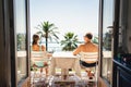 Balcony or terrace in a sea view room in hotel resort or villa. Couple on vacation. Luxury summer holiday.