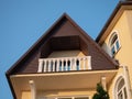 Balcony on the top floor with white balusters against the blue sky Royalty Free Stock Photo