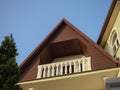 Balcony on the top floor with white balusters against the blue sky Royalty Free Stock Photo