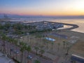 Balcony view over the port with many boats, volleyball court and the mediterranean sea in Larnaca town Royalty Free Stock Photo