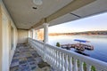 Balcony view with stone floor and white columns Royalty Free Stock Photo