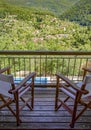Balcony with view to green nature. Zarouhla village in Ahaia, Greece. Royalty Free Stock Photo