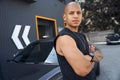 Bald African American man leaning on car standing outdoor Royalty Free Stock Photo