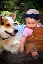 Bald Baby in Dirt with Dog