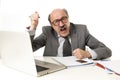 Bald business man 60s working stressed and frustrated at office computer laptop desk looking tired Royalty Free Stock Photo