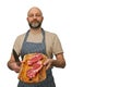 Bald butcher holding wooden cutting board with two fresh strip loin steaks. Meat industry. White isolated background. Prime cut of