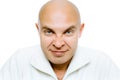 Bald evil grinning man. Isolated. Studio Royalty Free Stock Photo