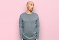 Bald man with beard wearing casual clothes smiling looking to the side and staring away thinking Royalty Free Stock Photo