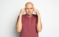 Bald man deeps in thought. Serious middle aged guy isolated on grey Royalty Free Stock Photo