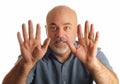 Bald man gesturing to stop