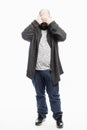 A bald man in jeans covered his face with his hands. Full height. White background. Vertical