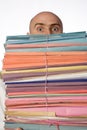 Bald Man Looking Over Stack Royalty Free Stock Photo