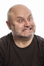 A bald man makes a face, close-up Royalty Free Stock Photo
