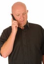 Bald Man with Mobile Phone Royalty Free Stock Photo