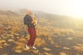 A bald man plays on a gold alto saxophone in the nature, against Royalty Free Stock Photo