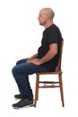 Bald man sitting on white background Royalty Free Stock Photo