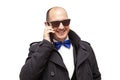 A bald man talking on his cell phone Royalty Free Stock Photo