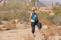 Bald Man is a tourist and photographer in Hampi. Large stones Hampi on the side of the village of Anegundi and Virupapur Gaddi.