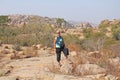 Bald Man is a tourist and photographer in Hampi. Large stones Hampi on the side of the village of Anegundi and Virupapur Gaddi.