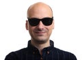Bald man wearing sunglasses isolated