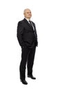 Bald middle-aged man in a suit, full-length, isolated on white background. Royalty Free Stock Photo