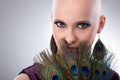 Bald woman with peacock plumes Royalty Free Stock Photo