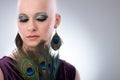 Bald woman with peacock plumes Royalty Free Stock Photo